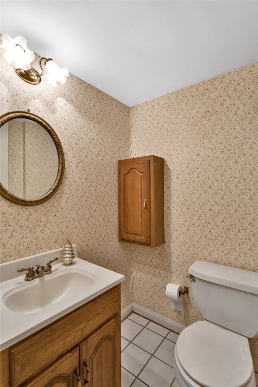 bathroom featuring tile patterned flooring, vanity, and toilet