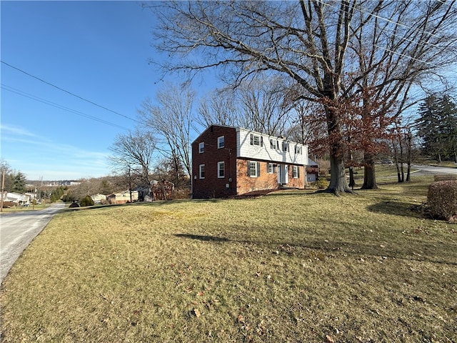 view of property exterior featuring a lawn