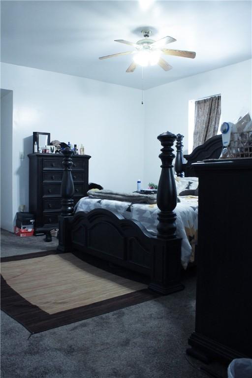 bedroom with ceiling fan and carpet floors