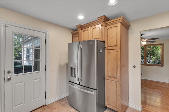 kitchen with light hardwood / wood-style flooring, ceiling fan, and stainless steel fridge with ice dispenser