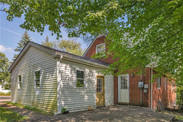 back of property with a patio