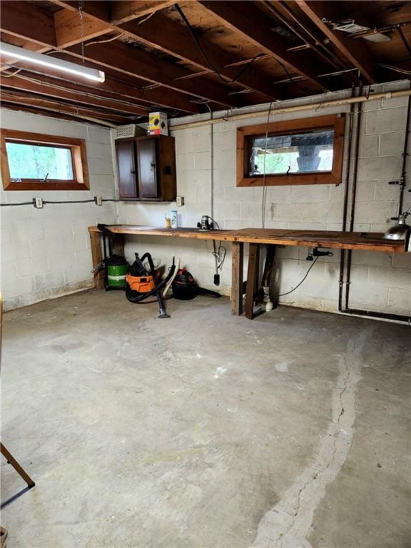 213 Fern St, Hopewell Twp Bea, PA 15001 - below grade area with a workshop area and concrete block wall