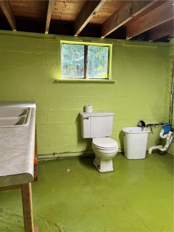 213 Fern St, Hopewell Twp Bea, PA 15001 - bathroom with concrete floors, vanity, toilet, and concrete block wall