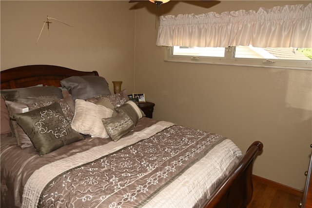 bedroom featuring wood-type flooring and ceiling fan