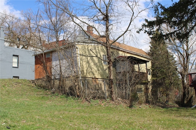 view of home's exterior featuring a lawn