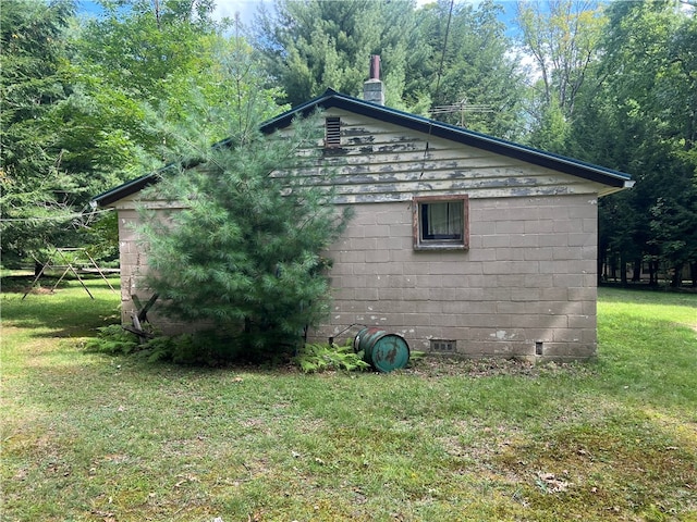 view of home's exterior featuring a yard