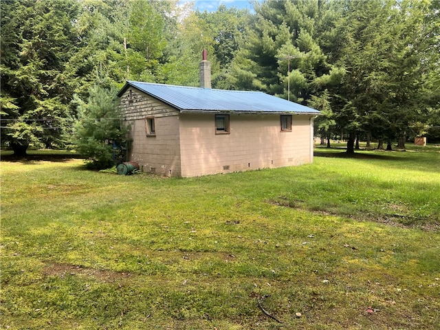 view of home's exterior with a yard