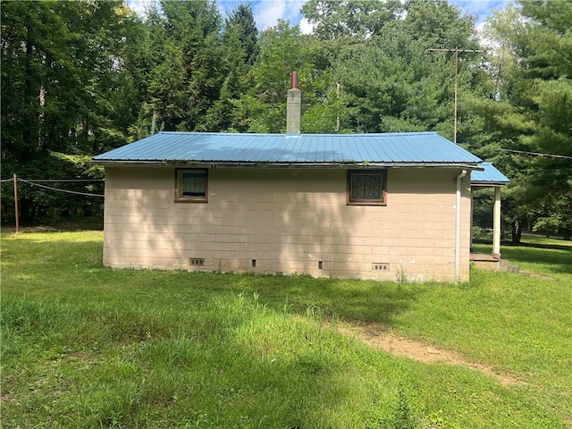 view of home's exterior with a yard