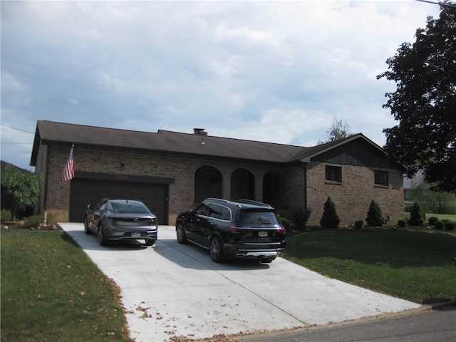 ranch-style house with a front yard and a garage