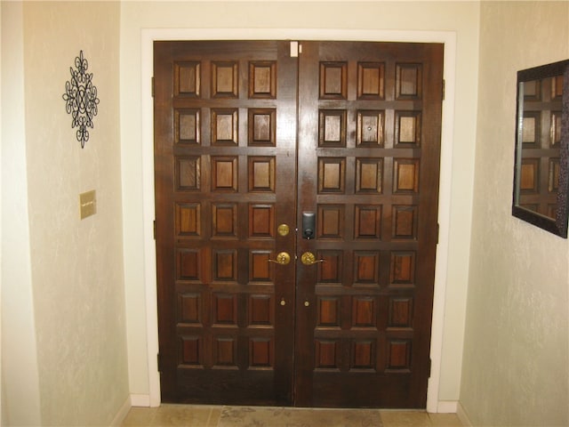 foyer entrance with tile patterned floors