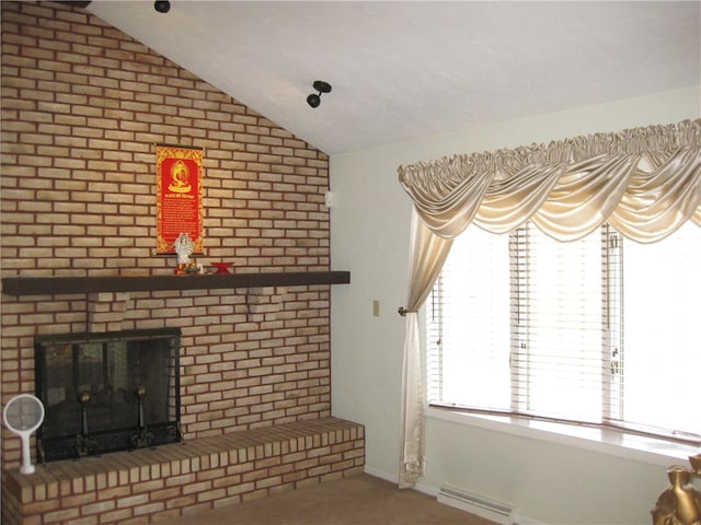 unfurnished living room with lofted ceiling, a wealth of natural light, and a brick fireplace