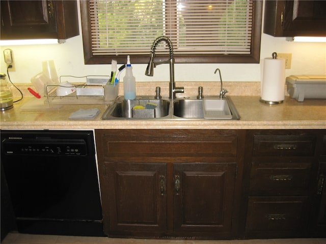 kitchen featuring black dishwasher, sink, and dark brown cabinets