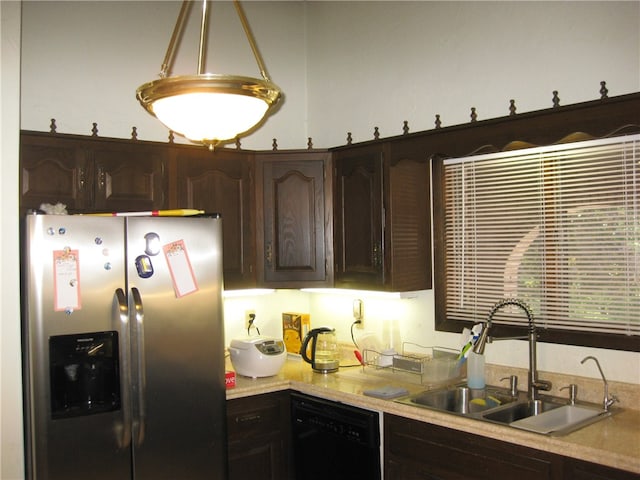 kitchen with black dishwasher, stainless steel fridge, dark brown cabinets, and sink