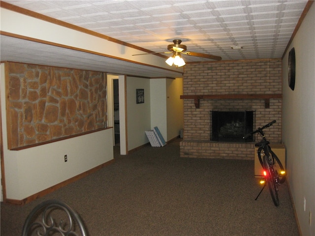 unfurnished living room featuring a fireplace, ceiling fan, and carpet flooring