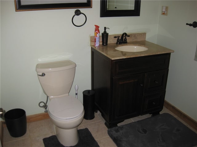 bathroom featuring vanity, toilet, and tile patterned floors