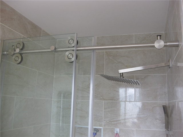 interior space with a shower with door