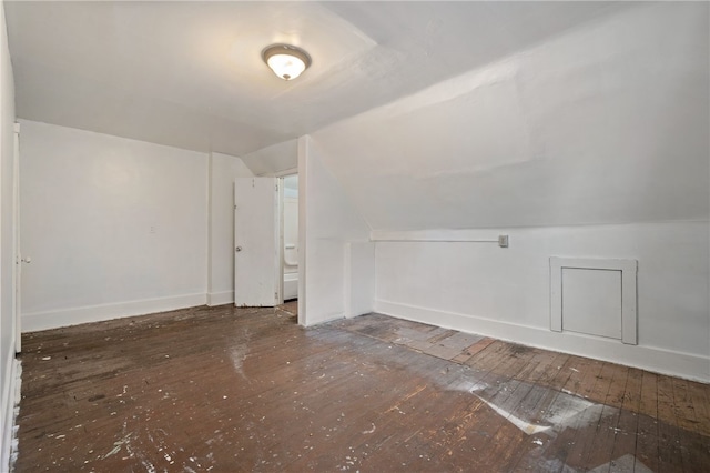 bonus room with lofted ceiling, baseboards, and hardwood / wood-style floors