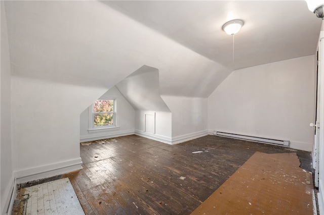 bonus room featuring a baseboard heating unit, baseboards, vaulted ceiling, and hardwood / wood-style floors