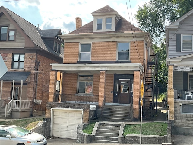 view of front of home with a garage and covered porch