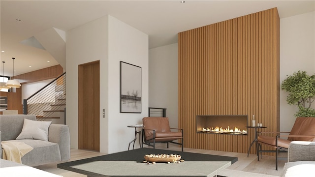 interior space with light hardwood / wood-style flooring and a large fireplace