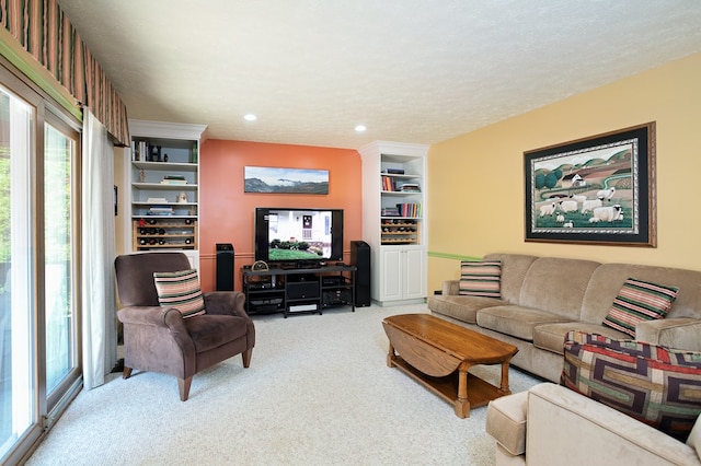 living room with a textured ceiling and carpet floors