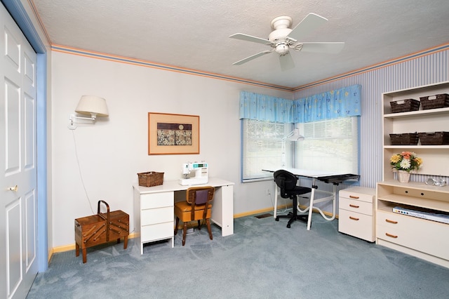 office space featuring ceiling fan, crown molding, a textured ceiling, and dark colored carpet