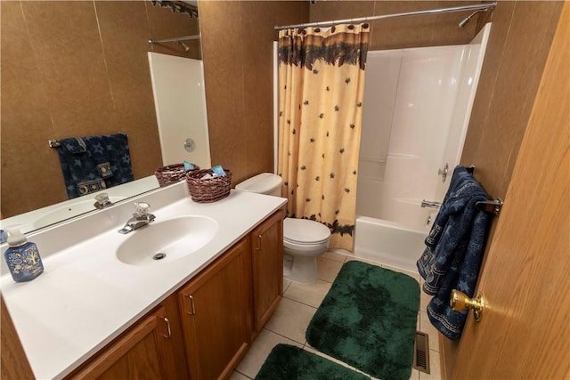 bathroom with toilet, shower / bath combination with curtain, tile patterned flooring, and vanity