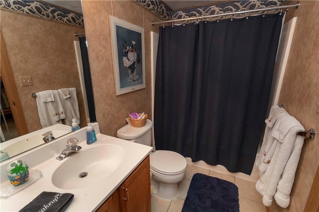 bathroom featuring toilet, tile patterned flooring, and vanity
