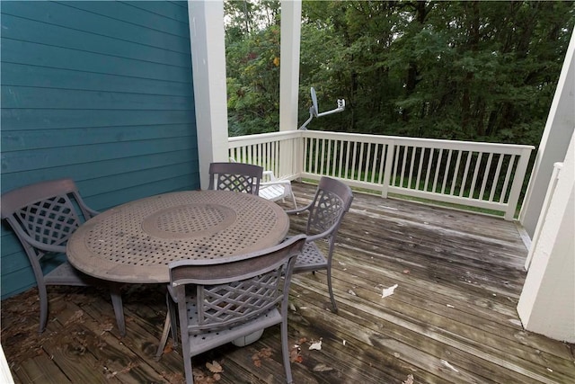 wooden deck with outdoor dining area