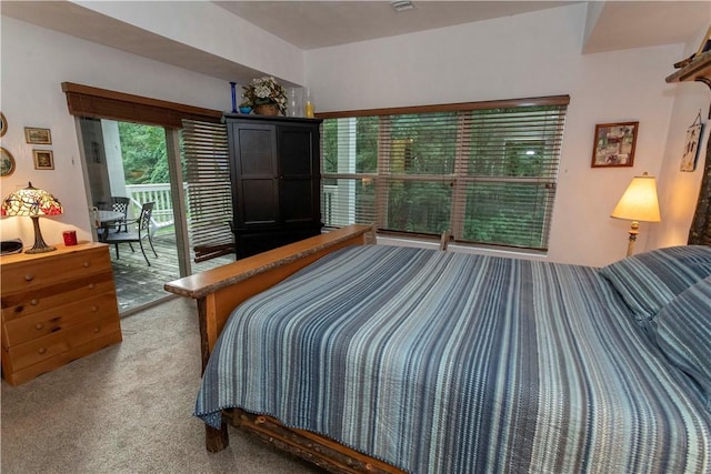 carpeted bedroom with access to outside