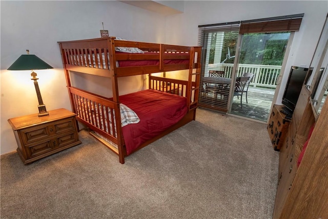 carpeted bedroom with access to exterior