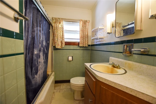 full bathroom with tile patterned flooring, toilet, tile walls, decorative backsplash, and vanity