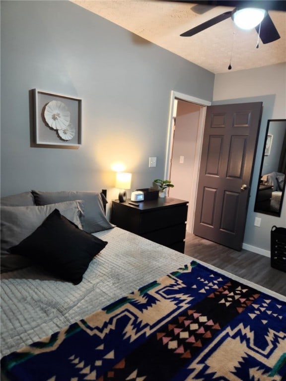 bedroom featuring hardwood / wood-style floors and ceiling fan