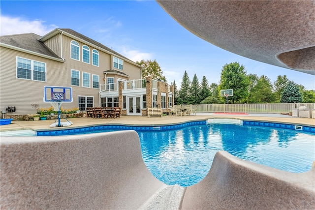 view of pool featuring french doors and a patio