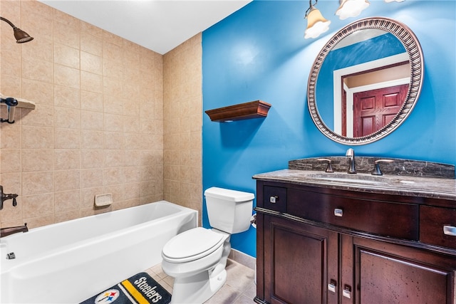 full bathroom with tile patterned flooring, vanity, toilet, and tiled shower / bath