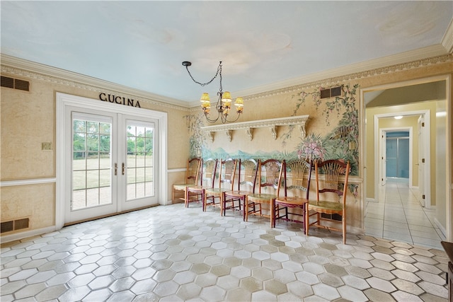 interior space with ornamental molding, french doors, and a chandelier