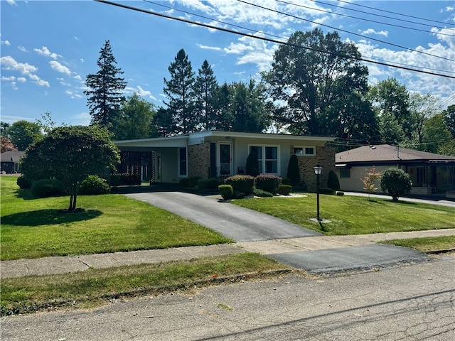 ranch-style house with a front lawn and a carport