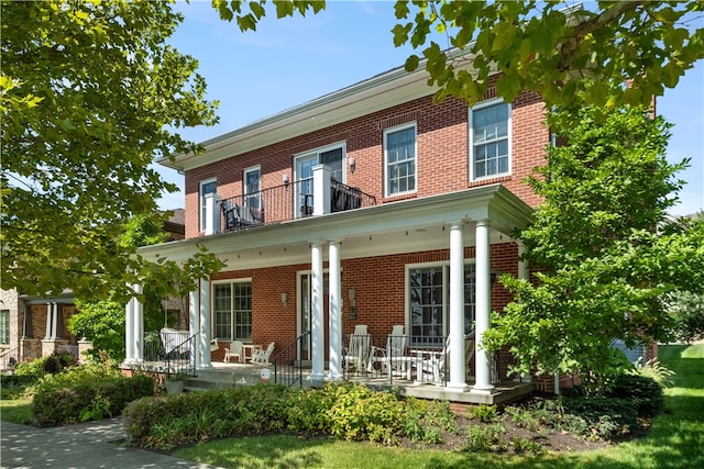 rear view of house with covered porch