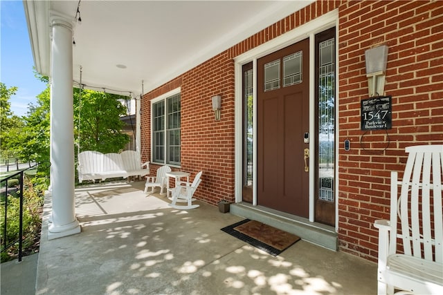 entrance to property featuring a porch