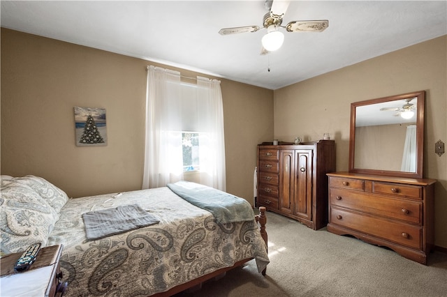 bedroom with light carpet and ceiling fan