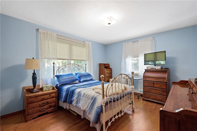 bedroom featuring dark wood-type flooring