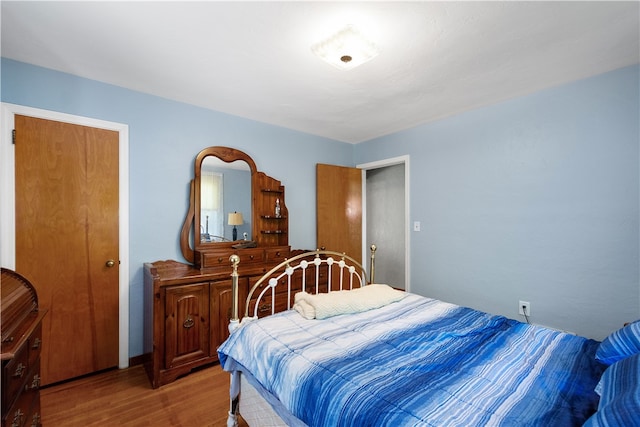 bedroom with light hardwood / wood-style floors