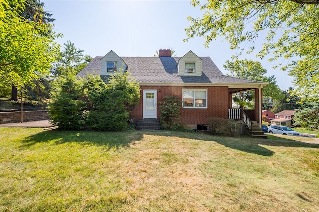 new england style home featuring a front lawn