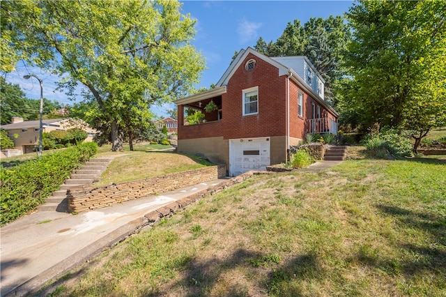 view of home's exterior with a garage and a lawn