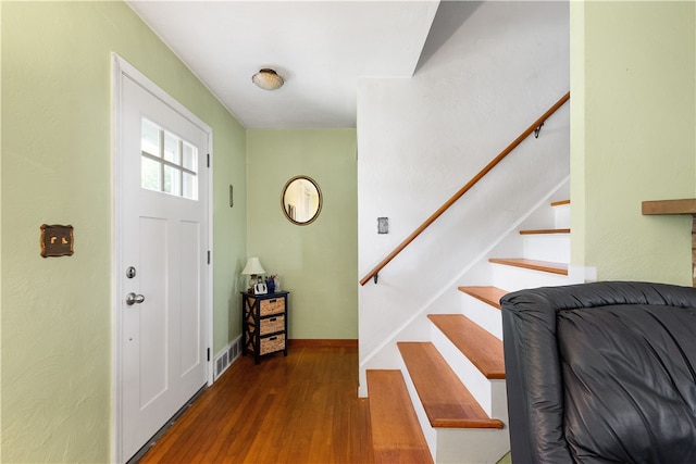 foyer entrance with dark wood-type flooring