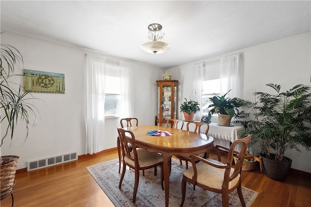 dining room featuring wood-type flooring