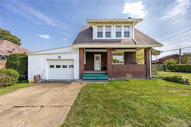 view of front facade featuring covered porch, a front yard, and a garage