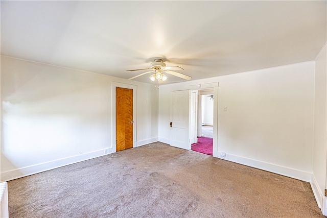 carpeted empty room with ceiling fan