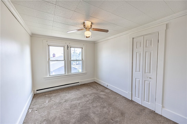 empty room with ceiling fan, ornamental molding, baseboard heating, and light colored carpet