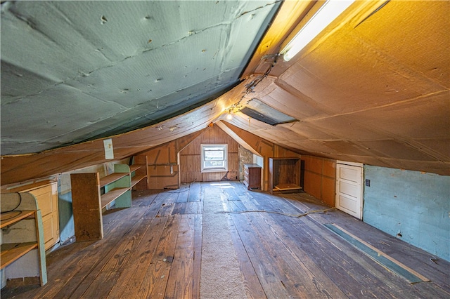 bonus room featuring lofted ceiling and dark wood-type flooring